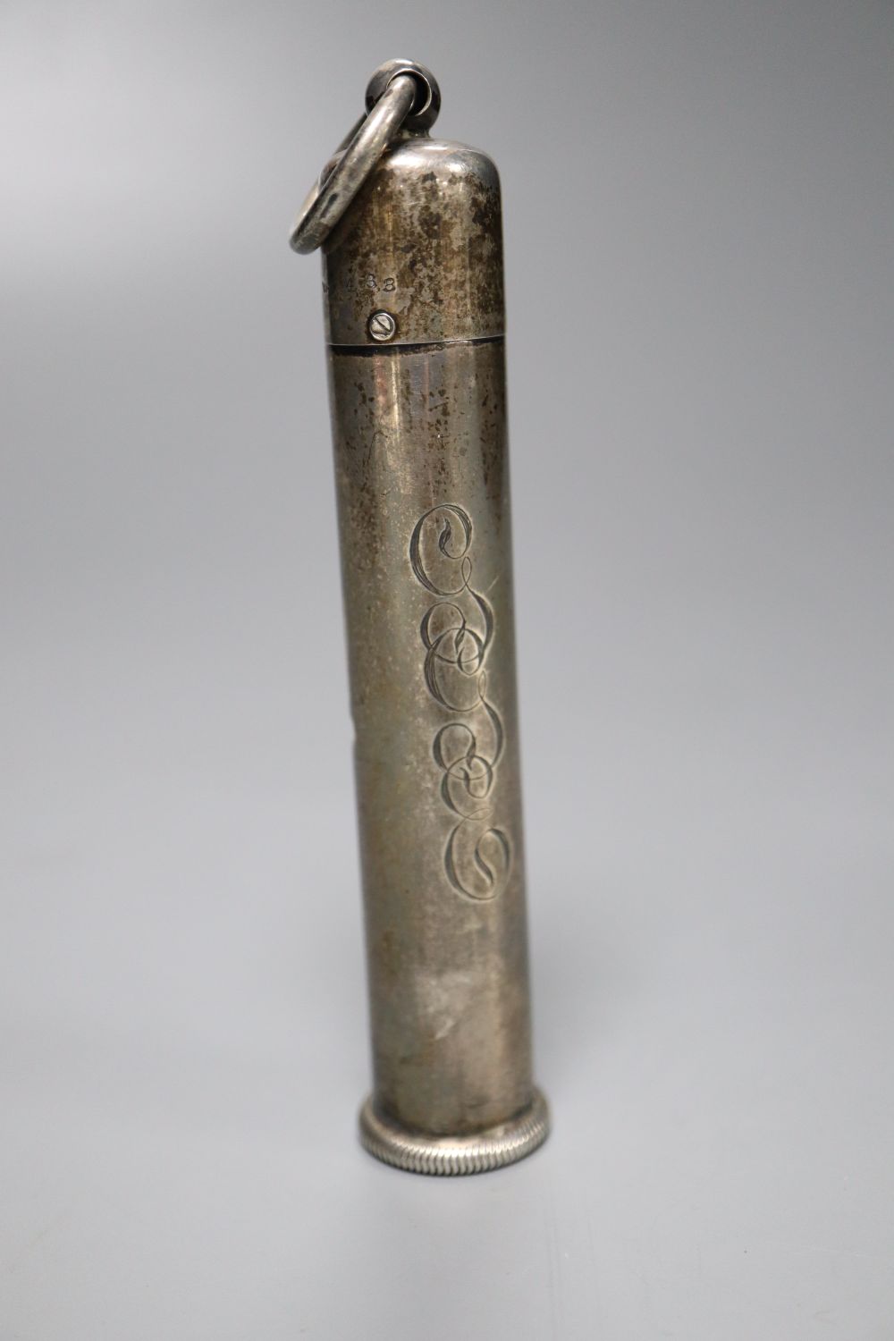 An early 20th century sterling mounted ivory cylindrical thermometer, with swivelling column, 11.2cm.